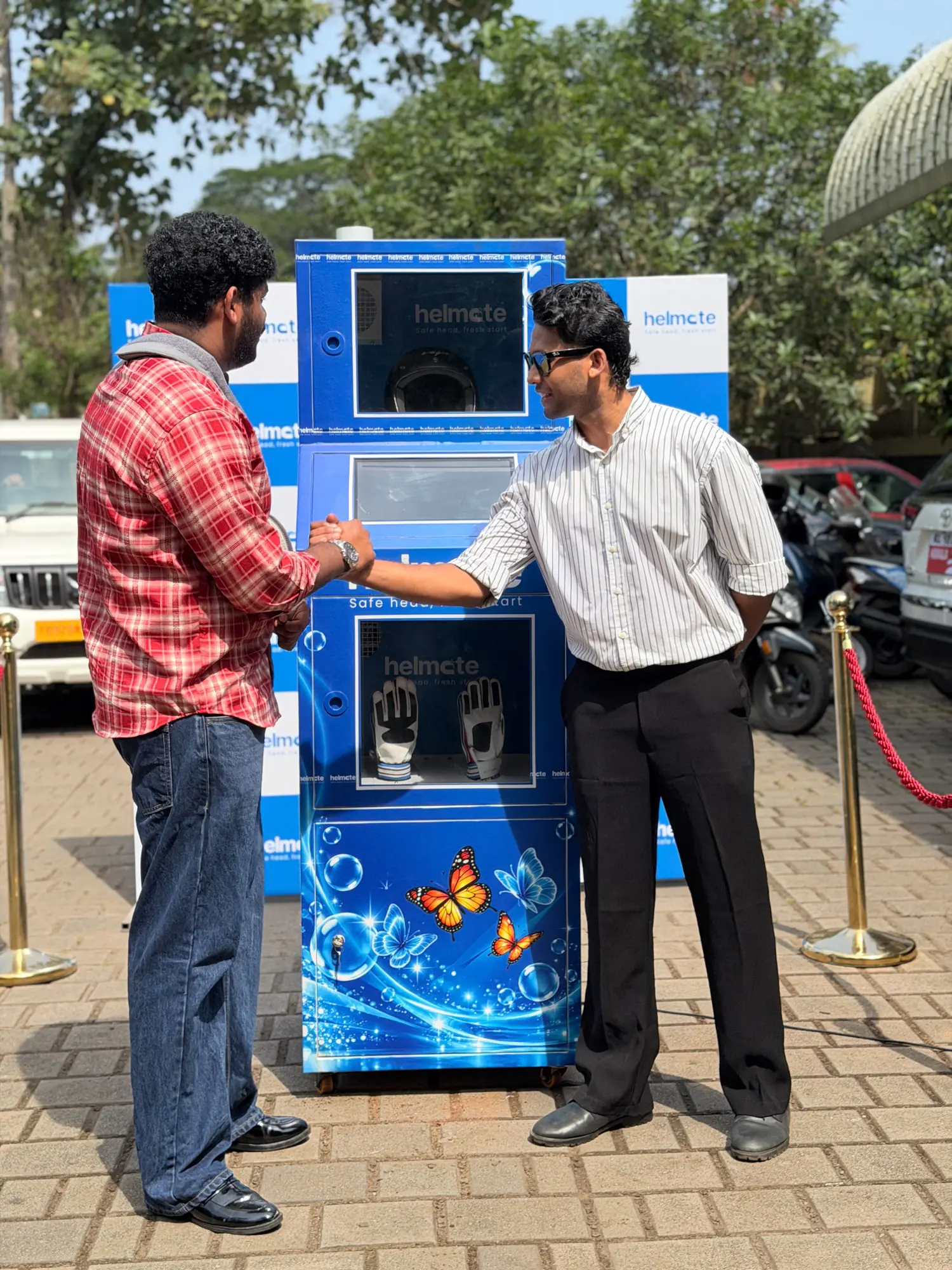 A Helmate team member handing over a newly installed machine to its owner